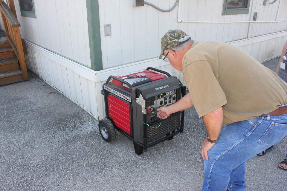 Man turning on a generator