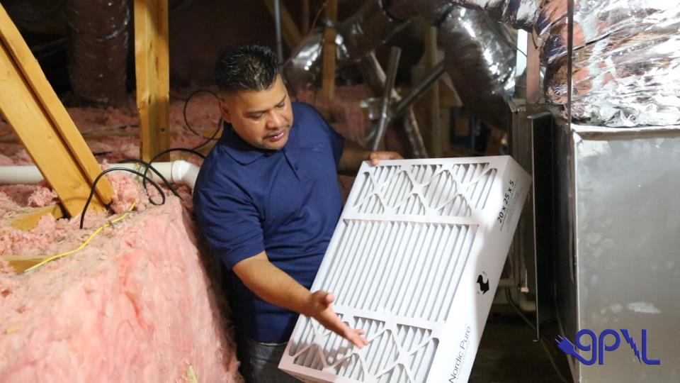 Man holding an air filter